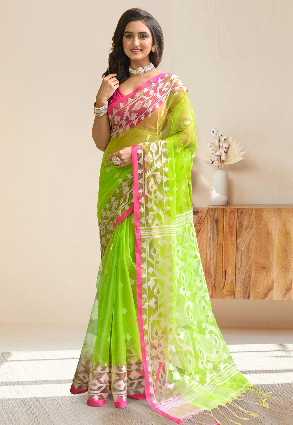 PURE HANDWOVEN MUSLIN SILK SAREE IN GREEN COLOR WITH OFFWHITE FLORAL MOTIFS AND PINK BORDER