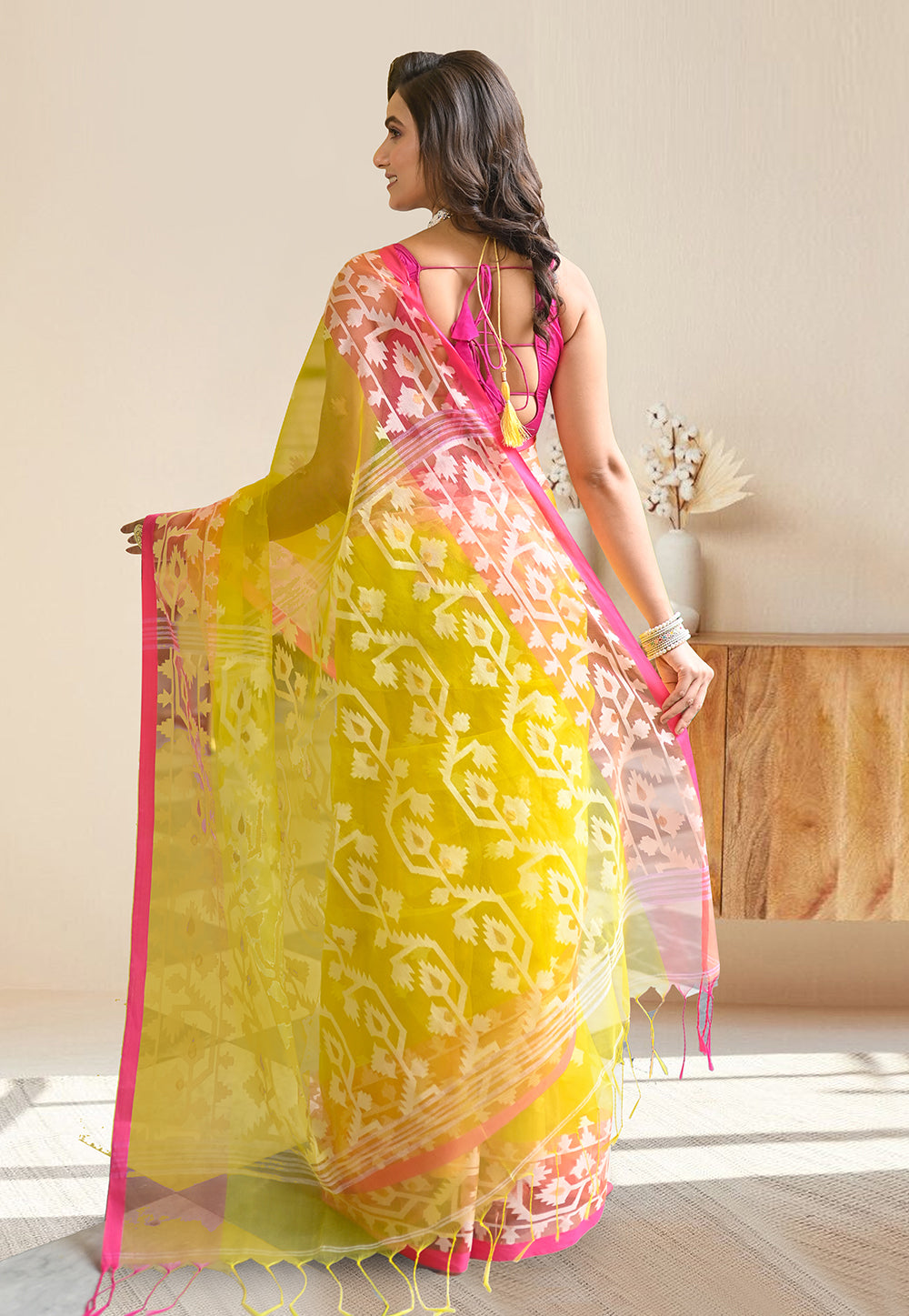 PURE HANDWOVEN MUSLIN SILK SAREE IN YELLOW COLOR WITH OFFWHITE FLORAL MOTIFS AND PINK BORDER