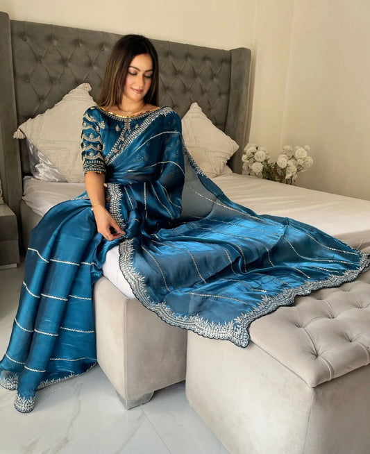 JIMMY CHOO SAREE IN TEAL BLUE COLOR WITH SEQUIN EMBROIDERY Including Ready To Wear Blouse