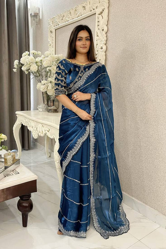 JIMMY CHOO SAREE IN TEAL BLUE COLOR WITH SEQUIN EMBROIDERY Including Ready To Wear Blouse