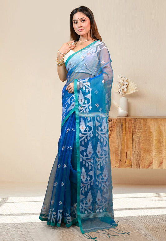 PURE HANDWOVEN MUSLIN SILK SAREE IN TEAL BLUE COLOR WITH OFFWHITE FLORAL MOTIFS AND GREEN BORDER