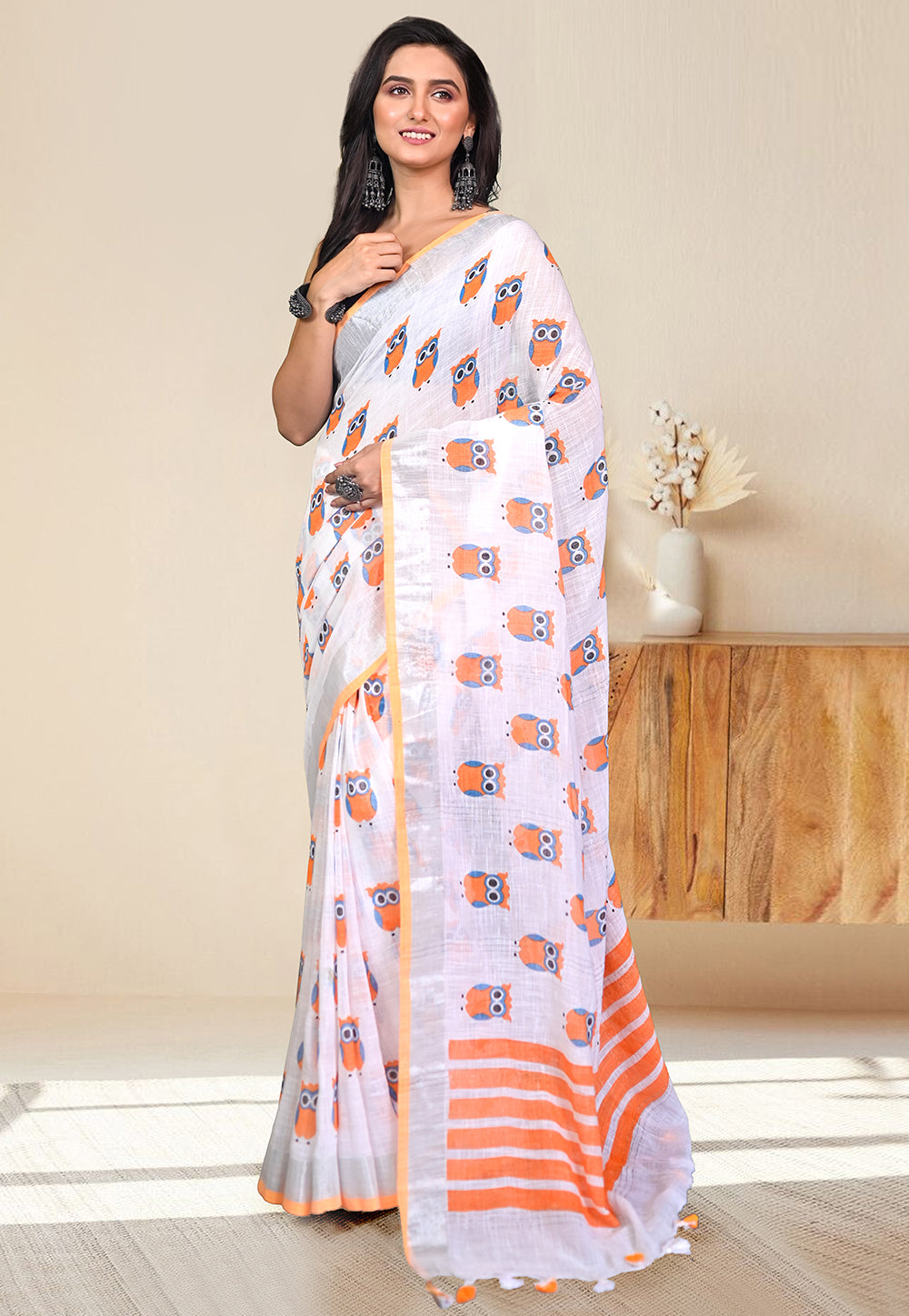 HANDLOOM LINEN SAREE IN OFFWHITE COLOR WITH ORANGE OWL BLOCK PRINTS ALL OVER BODY